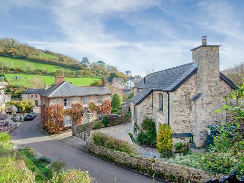 an old stone house in a small village at Wheelwright Cottages in Branscombe