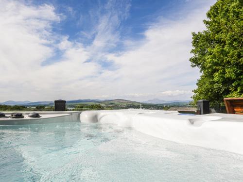 a swimming pool with a view of mountains at Clyde View in Langbank