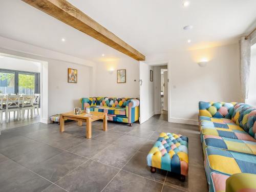 a living room with couches and a table at Orchard Barns - Uk47200 in Stapleton
