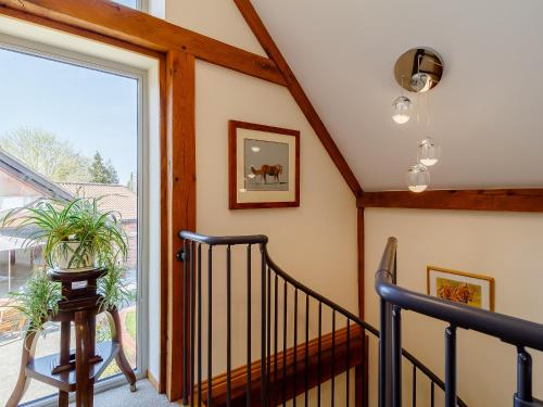 a staircase in a house with a window at Granary Barn - Ukc5405 in Banham