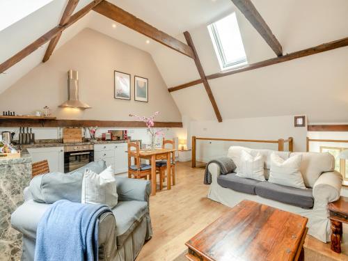 a living room with two couches and a table at The Cartlodge - Ukc1039 in Hickling