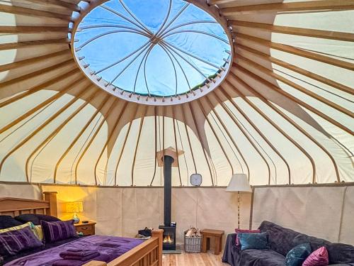 a room with a large ceiling with a large window at Ember Sky Yurt - Uk51679 in Beadnell