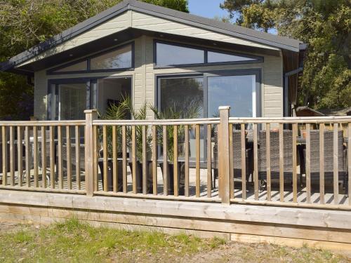 a small house with a wooden fence at Seacliff in Corton