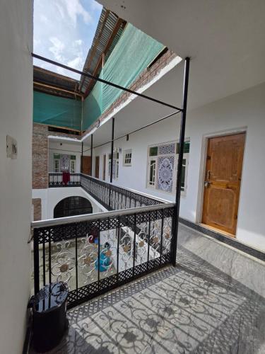 a balcony with a wrought iron fence and a door at Payer Resort in Pharkian