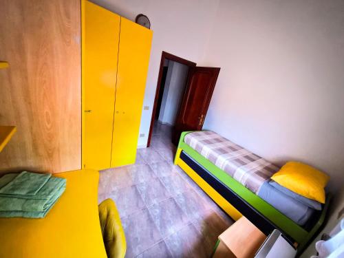 a small room with a bunk bed and a cabinet at Big Apartment in Assemini
