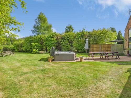 a backyard with a grill and a picnic table at Willow Barn - Czb in Neatishead