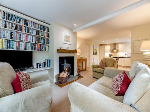 a living room with two couches and a fireplace at Fox Cover - Uk49892 in Preston