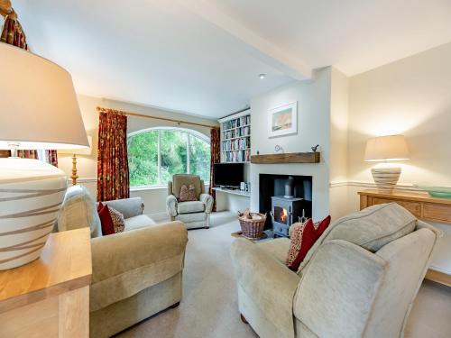 a living room with a couch and a fireplace at Fox Cover - Uk49892 in Preston