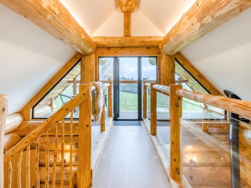 a staircase in a house with wooden beams at Hope Hideaway in Buttington