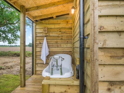 a wooden outhouse with a toilet in it at Stillwater in Rockland Saint Peter