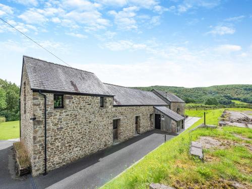 an external view of a stone house at Y Stabl in Llangadog