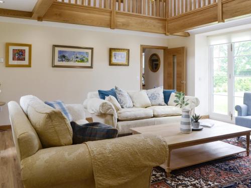 a living room with two couches and a coffee table at The Stables - Uk11108 in Montrose