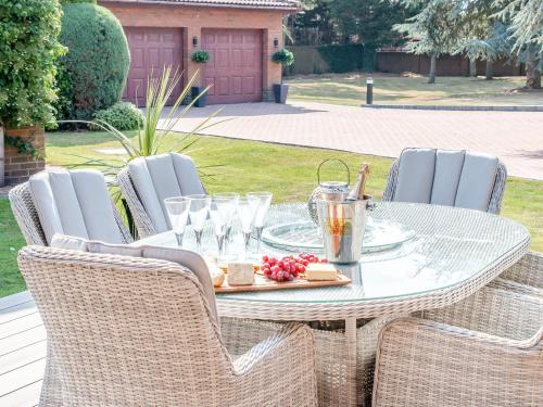 a table and chairs with a table and drinks on it at The Hawthorns in Ottringham