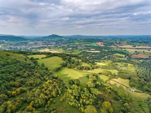 an overhead view of a green valley with trees at The Lodge in Wonastow