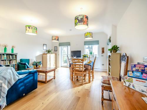 a living room with a couch and a table at Larks Nest in Wortham
