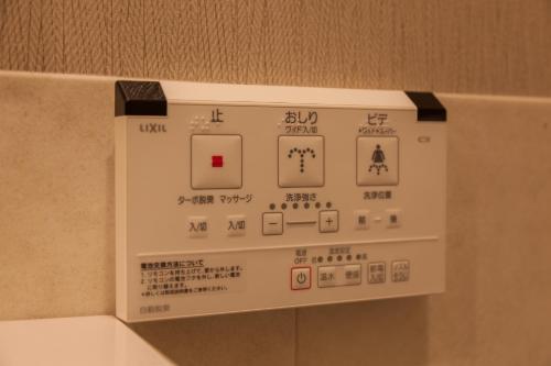 a close up of a control panel on a wall at HOTEL THE CUBE Naha Kokusai Street in Naha