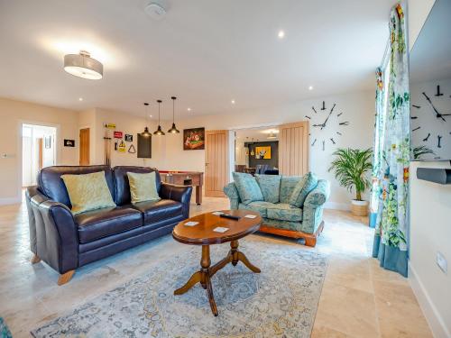 a living room with two couches and a table at Old Barn 2 - Uk48478 in Ferndown