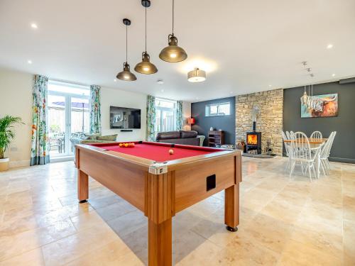 a pool table in a room with a living room at Old Barn 2 - Uk48478 in Ferndown