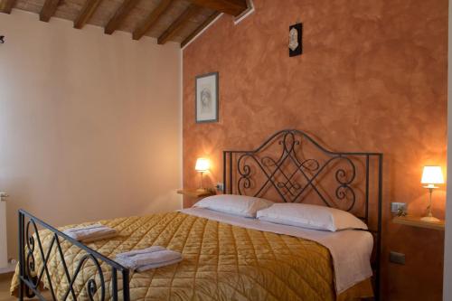 a bedroom with a large bed in a room at Bea Villa Bea in Caldarola