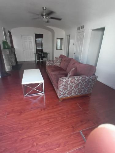 a living room with a couch and a table at Unit 1 - Modern Roosevelt Row Condo 2BR 1BA Downtown Stay in Phoenix
