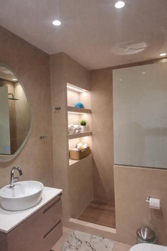 a bathroom with a sink and a shower at Memories in Tinos