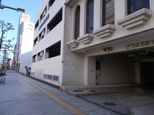 a building on the side of a street at Hotel Matsuyama Hills in Matsuyama