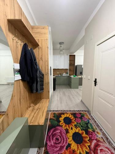 a room with a door and a rug on the floor at 3 room SUPERIOR APARTMENT at ELITE TOWER in downtown NURBIE'S TRAVEL in Ölgiy