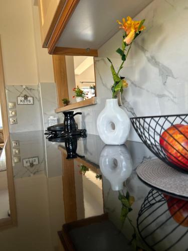 a bathroom with a toilet and a sink at Ada's House 2 in Mytikas