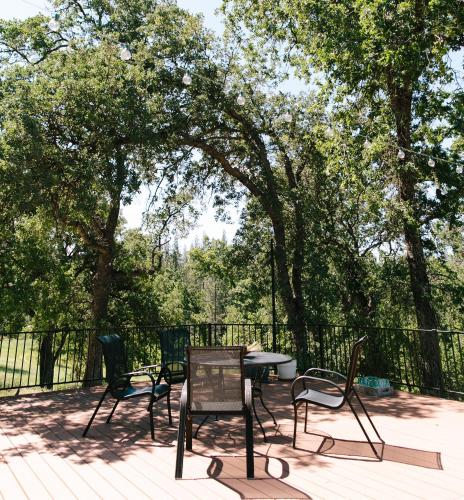 a group of chairs and a table on a deck at Red Tail Ranch in Groveland