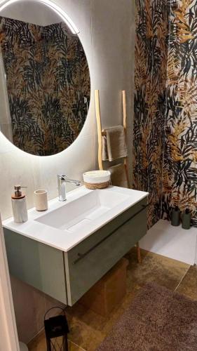 a bathroom with a sink and a mirror at Dimora degli Ulivi in Bagnaia