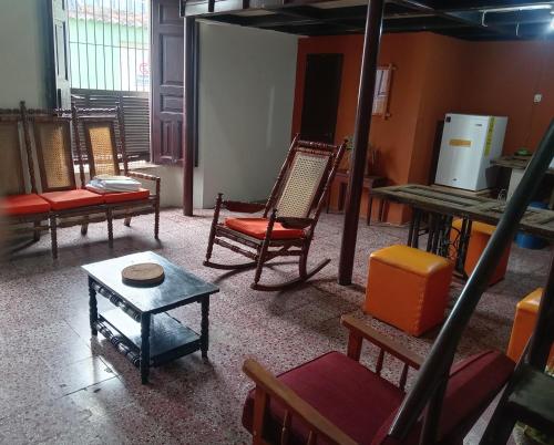 a room with chairs and a table in a room at "Casa de Piobeto" in Santa Ana