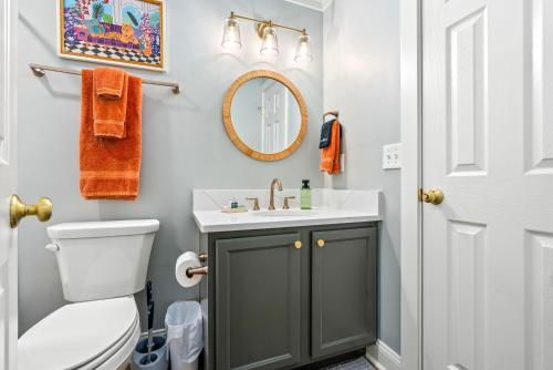 a bathroom with a sink and a toilet at Roaring On Ross In Auburn in Auburn