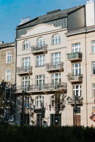 a large building with balconies on the side of it at Hotel M4 Boutique in Krakow