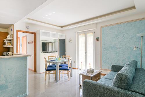 a living room with a couch and a table at Casa Norb Lerici - with Private Parking in Lerici