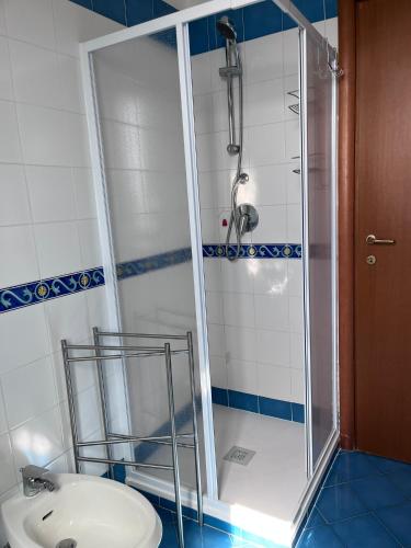 a shower in a bathroom with a toilet and a sink at Il Casalino in Maratea