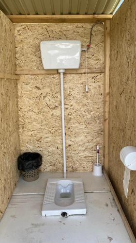 a bathroom with a sink and a toilet at Aalam yurt camp Altyn-Arashan in Mineralʼnyy Istochnik Altyn-Arasan