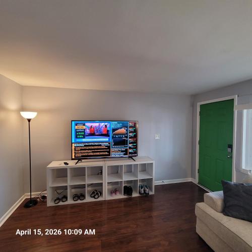 a living room with a flat screen tv on a wall at The Haven in Dundalk