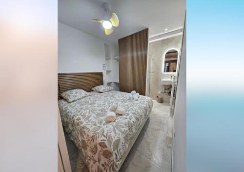 a bedroom with a bed with two teddy bears on it at L'olivier du vieil Antibes in Antibes