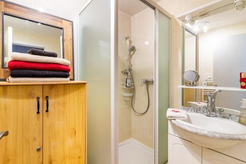 a bathroom with a sink and a shower at Chalet Les Angles in Les Angles