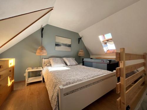 a bedroom with a bed in a attic at Chalet Les Angles in Les Angles