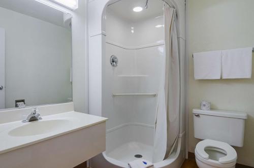 a bathroom with a sink and a toilet and a shower at Motel 6-Mitchell, SD in Mitchell