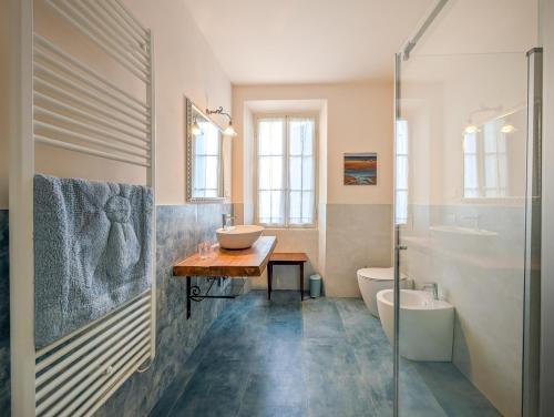 a bathroom with a sink and a glass shower at Villa Cristani in Pedemonte