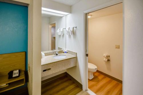 a bathroom with a sink and a toilet at Motel 6-Katy, TX - Houston in Katy