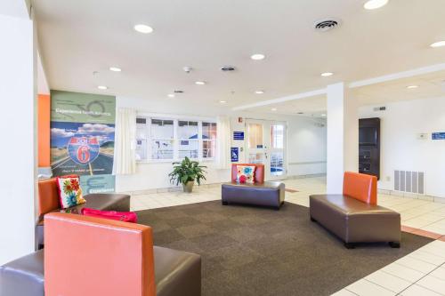 a lobby with couches and chairs in a building at Motel 6-Huron, OH - Sandusky in Huron