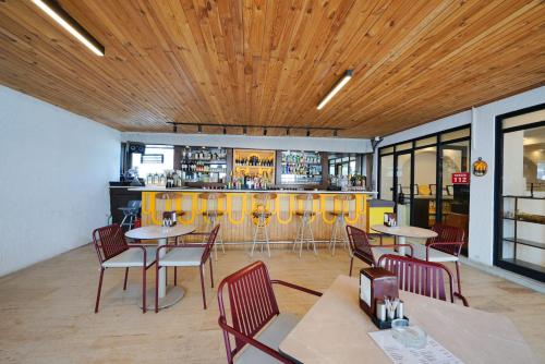 a restaurant with tables and chairs and a bar at Casa Lume in Bodrum City