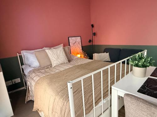 a bedroom with a bed with a white rail at The Seabreeze Terrace Apartment in Turku