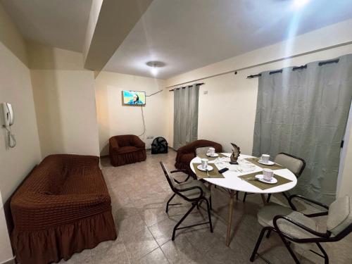 a living room with a white table and chairs at Depto Clarita in Belén