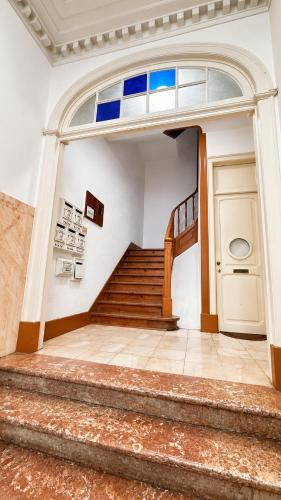 a set of stairs in a building with a door at Avenidas Prime Lisbon in Lisbon