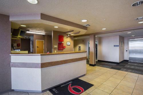 a lobby of a hospital with a reception counter at Motel 6-Bernalillo, NM in Bernalillo