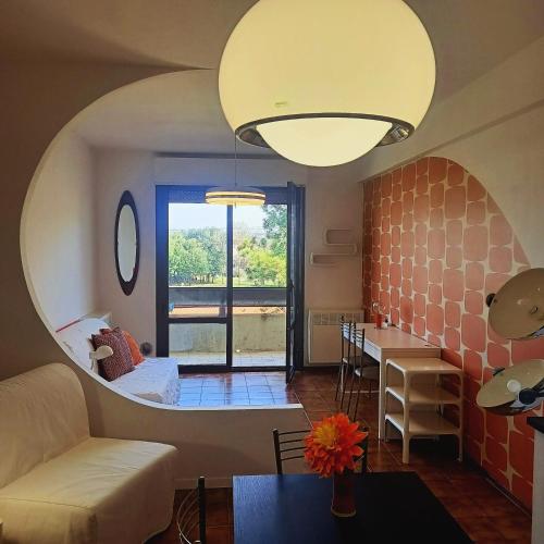 a living room with a couch and a table at Appartamento Velocipede in Cervignano del Friuli